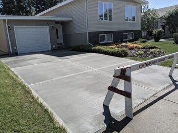 A large finished concrete driveway 