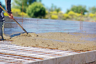 A fresh concrete pour for a foundation installation